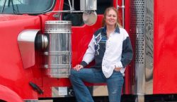 Truck driver outside of her cab