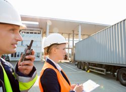 Workers inspecting trucks