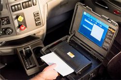 iGlobal Edge electronic logging device (ELD) scanning a document inside a truck cab
