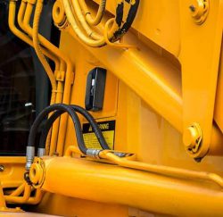 Powered by six AA batteries, the iVision X.2 mounted to construction equipment, by iGlobal, LLC